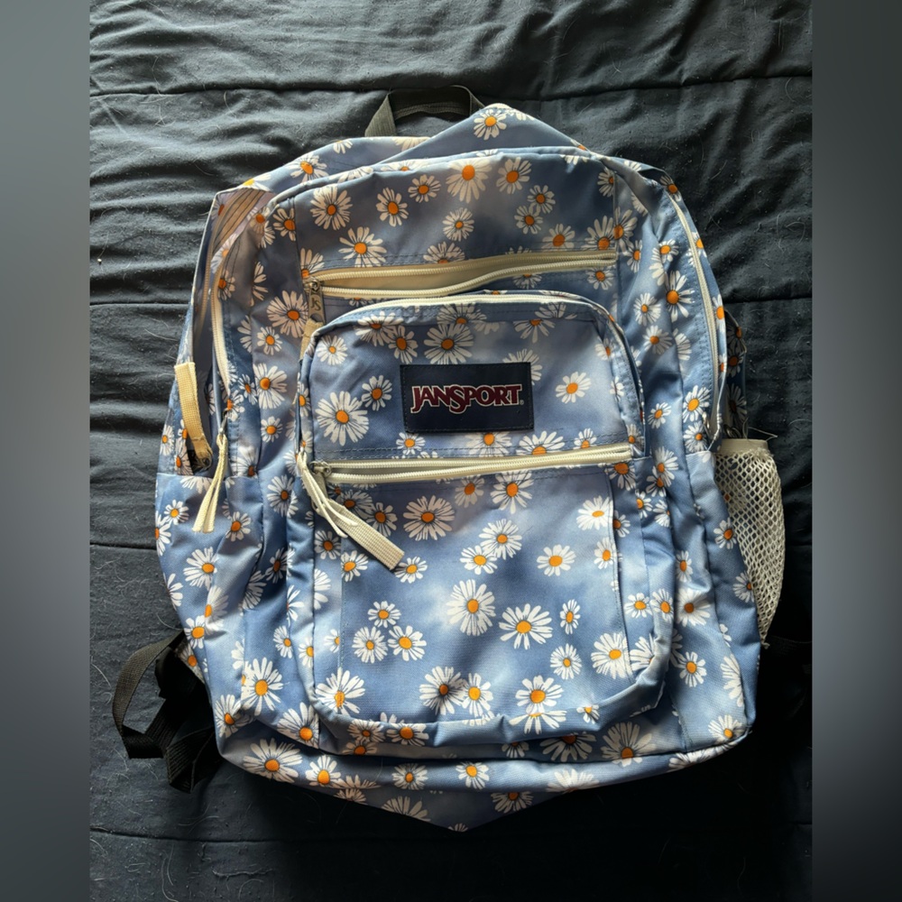 jansport backpack, blue base and orange and yellow flowers
